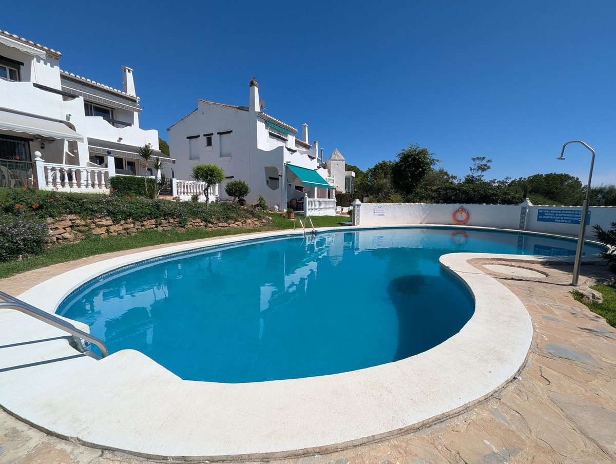 Communal pool and residential buildings at a CostaSpace property in Calahonda