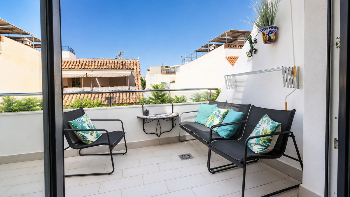A bright terrace at a Los Boliches property